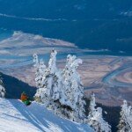 A snowboarder on the slopes at Revelstoke Mountain Resort.