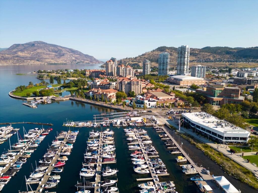Aerial view of the Kelowna marina and waterfront resorts, a central hub for exploring Okanagan wine country.